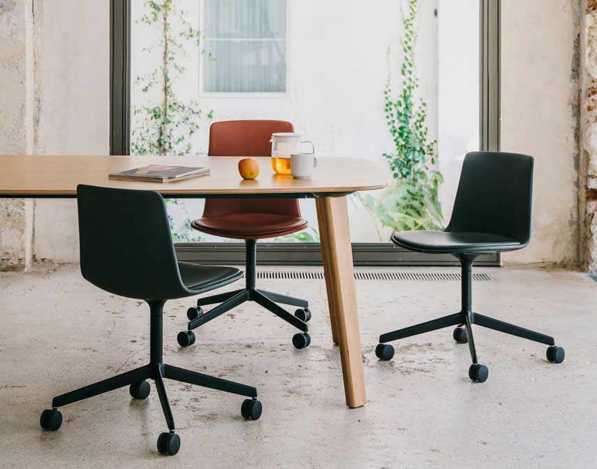Low backed Lottus chair at a table