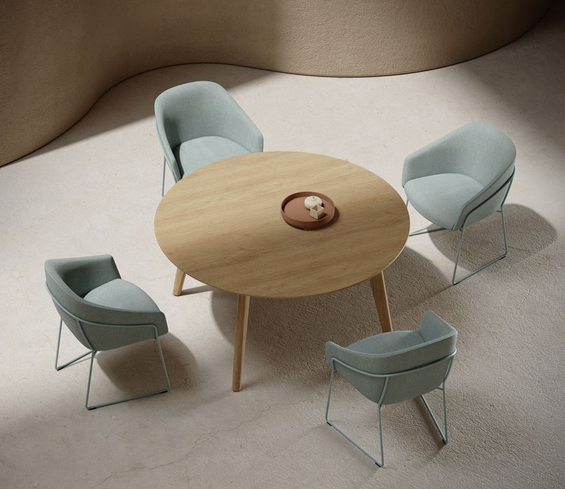 Niko table Niko round meeting table with upholstered chairs.