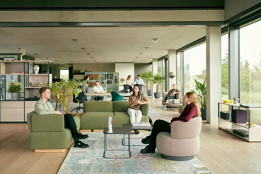 Breakout furniture Breakout space with sofa and lounge chair in office